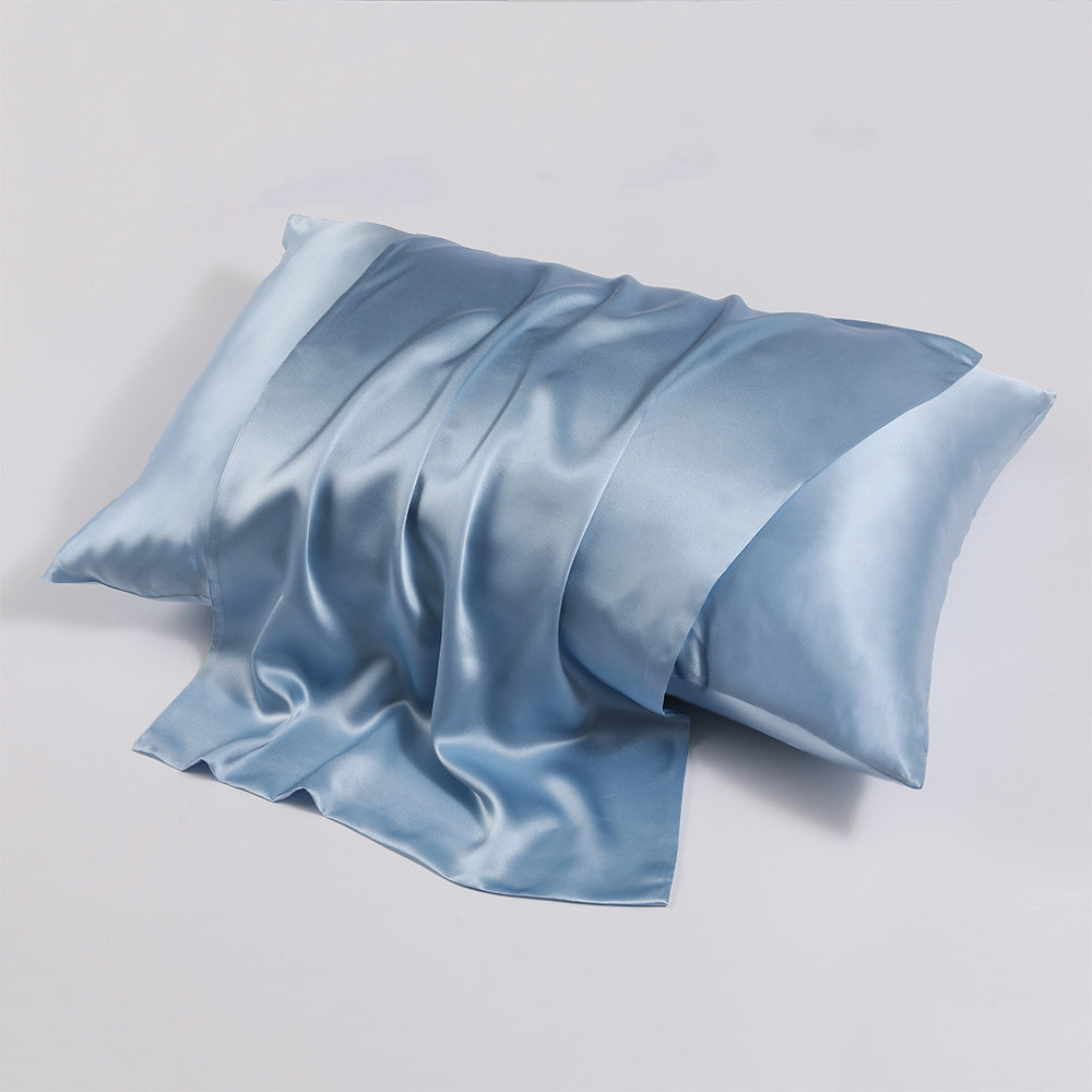 Close-up shot of ohmysilk Silver Blue 22 momme mulberry silk pillowcase with a secure envelope closure, showing natural silk texture and soft wrinkles.