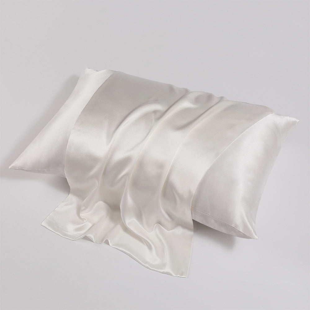 Close-up shot of ohmysilk White 22 momme mulberry silk pillowcase with a secure envelope closure, showing natural silk texture and soft wrinkles.